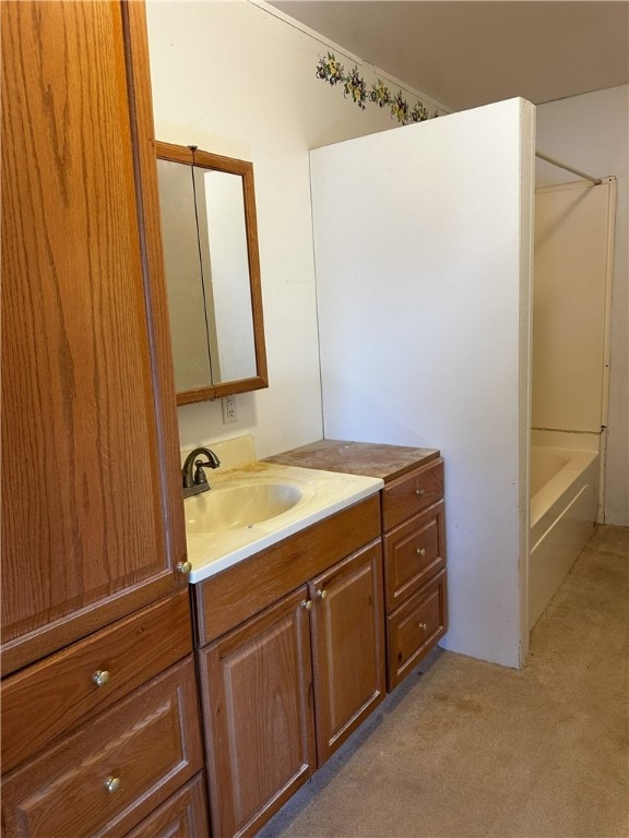 bathroom featuring vanity and  shower combination