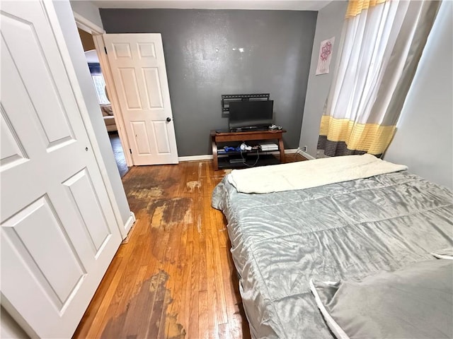 bedroom featuring dark hardwood / wood-style flooring