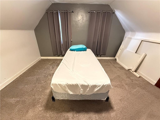 carpeted bedroom featuring lofted ceiling