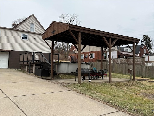 view of patio featuring a garage