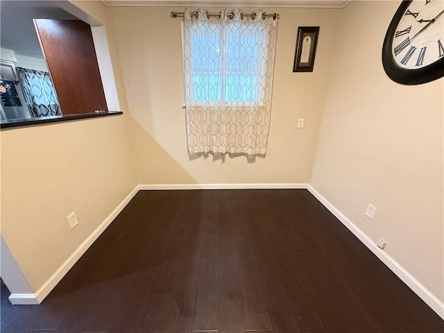 empty room with dark wood-type flooring