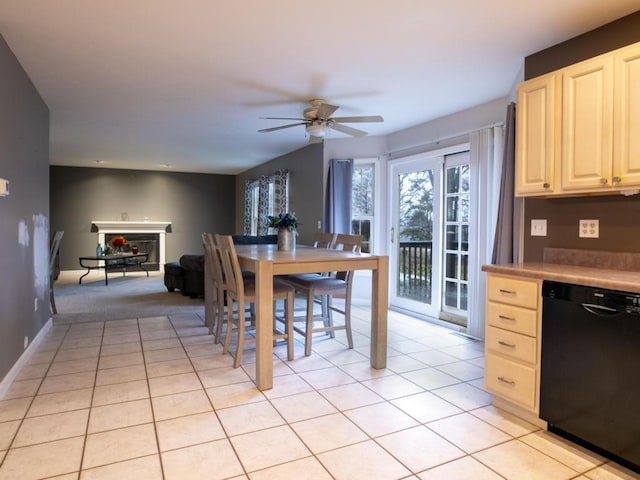 kitchen with light tile patterned floors, dishwasher, and ceiling fan