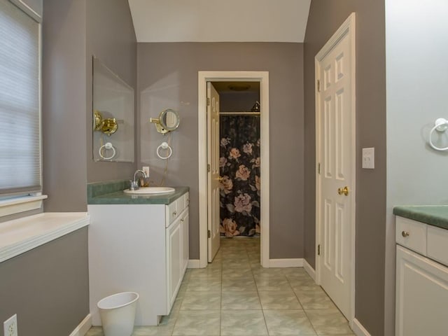 bathroom with tile patterned flooring and vanity