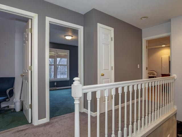 hallway featuring carpet flooring