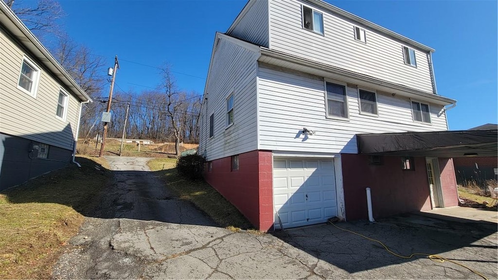 view of side of property with a garage