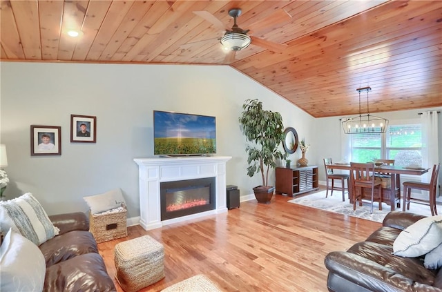 living room featuring vaulted ceiling, ceiling fan with notable chandelier, wood ceiling, and light hardwood / wood-style floors