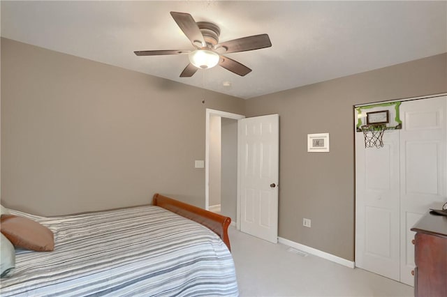 bedroom with light colored carpet, a closet, and ceiling fan