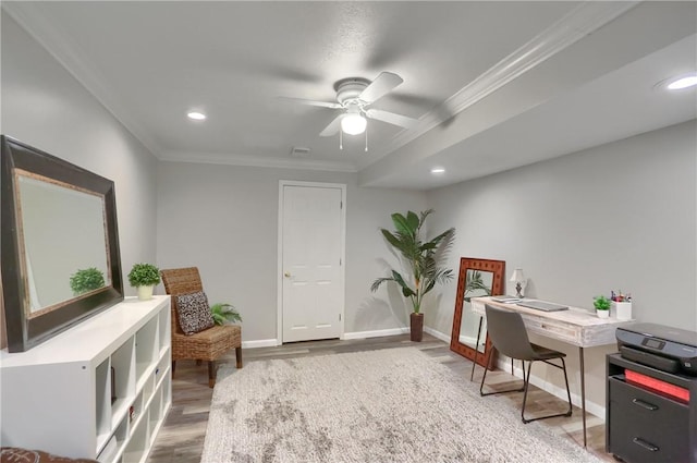 home office with ceiling fan, ornamental molding, and hardwood / wood-style floors