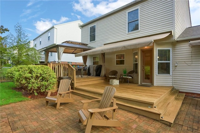 back of house featuring a gazebo, a patio area, and a deck