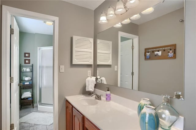 bathroom featuring vanity and an enclosed shower