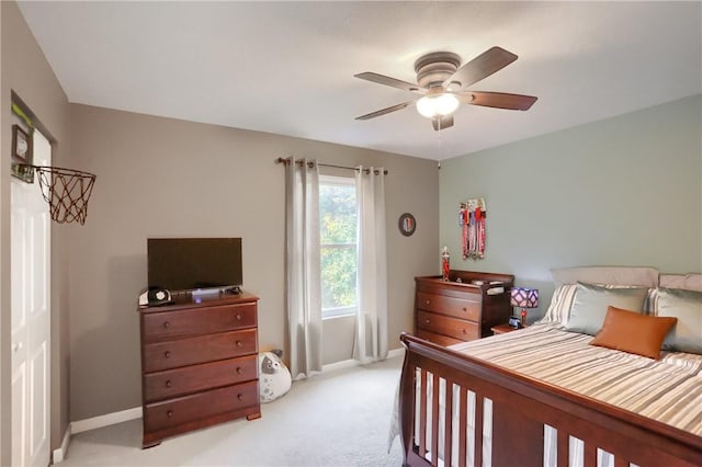 bedroom with light colored carpet and ceiling fan