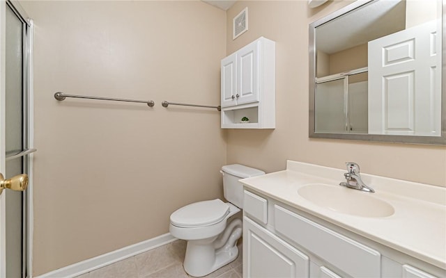 bathroom with vanity, toilet, an enclosed shower, and tile patterned flooring