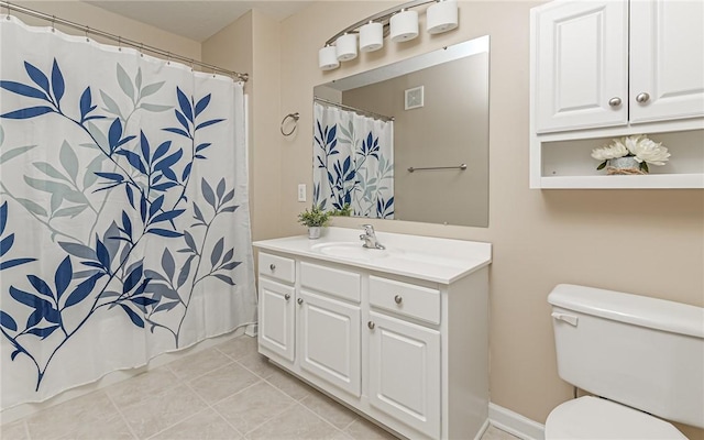 bathroom featuring a shower with shower curtain, vanity, toilet, and tile patterned flooring