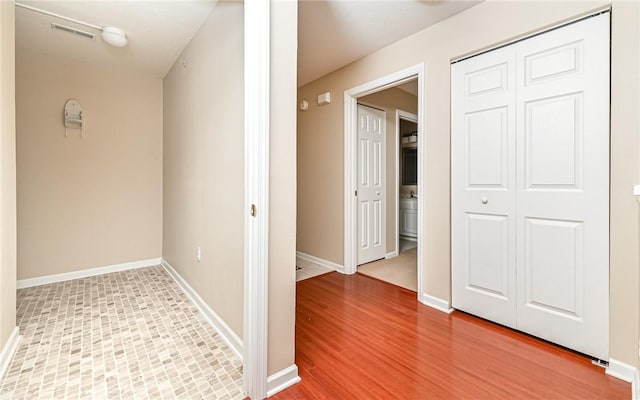 hallway featuring wood-type flooring