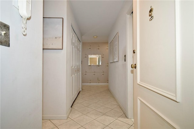 corridor with light tile patterned floors