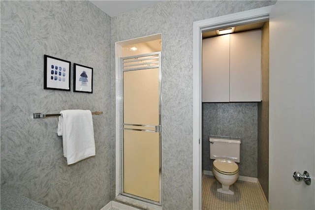 bathroom with tile patterned flooring and toilet