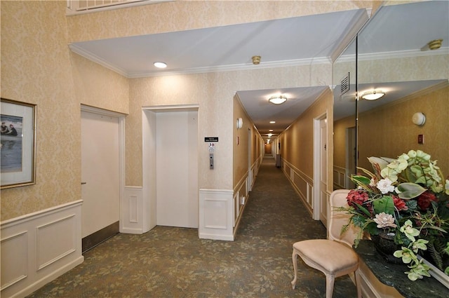 hall featuring elevator and ornamental molding