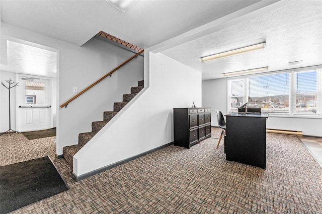 interior space with a baseboard radiator, carpet flooring, and a textured ceiling