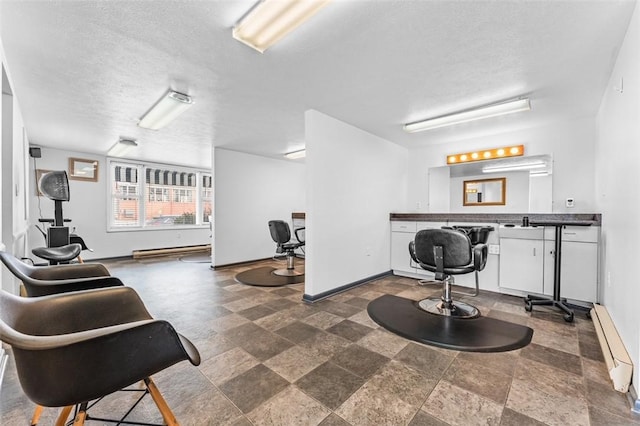 interior space with bar area, a textured ceiling, and baseboard heating