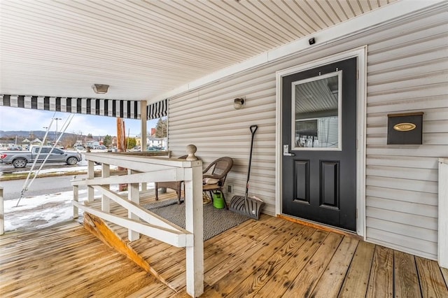 wooden deck featuring covered porch