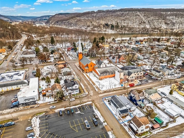 snowy aerial view with a mountain view