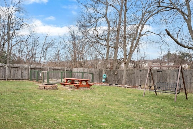 view of yard with an outdoor fire pit