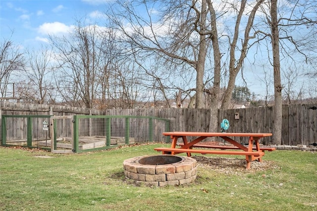 view of yard with an outdoor fire pit