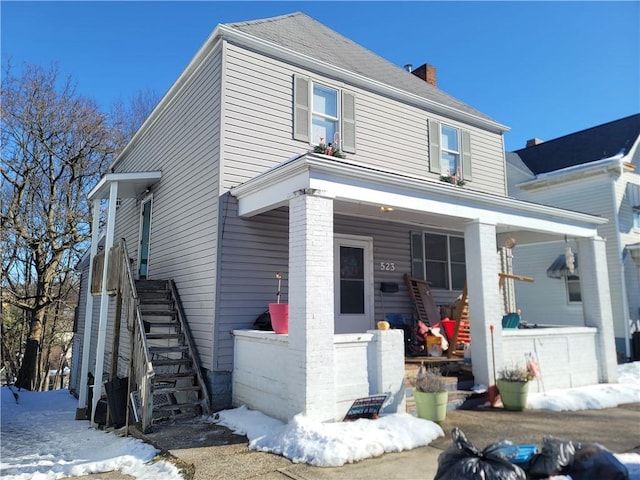 view of front of property featuring covered porch