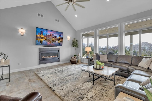 living room featuring ceiling fan, high vaulted ceiling, and a wealth of natural light