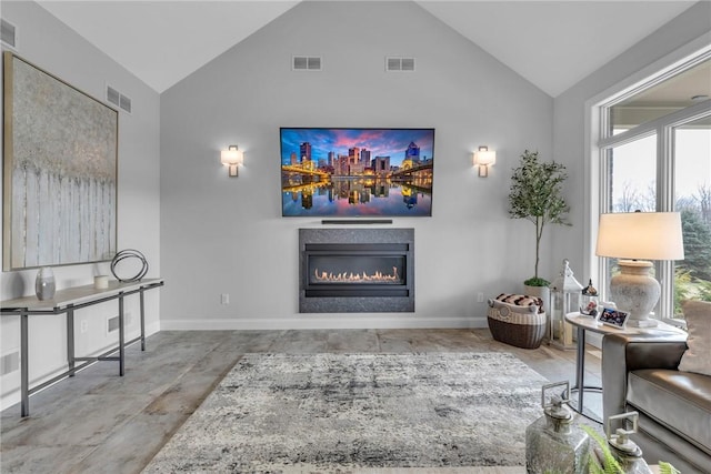 living room with high vaulted ceiling