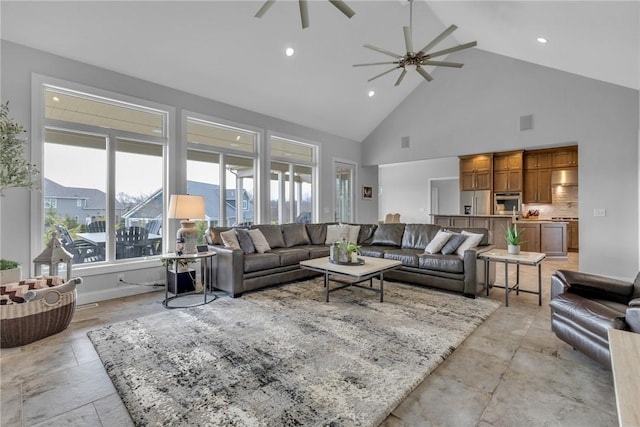 living room with high vaulted ceiling and ceiling fan