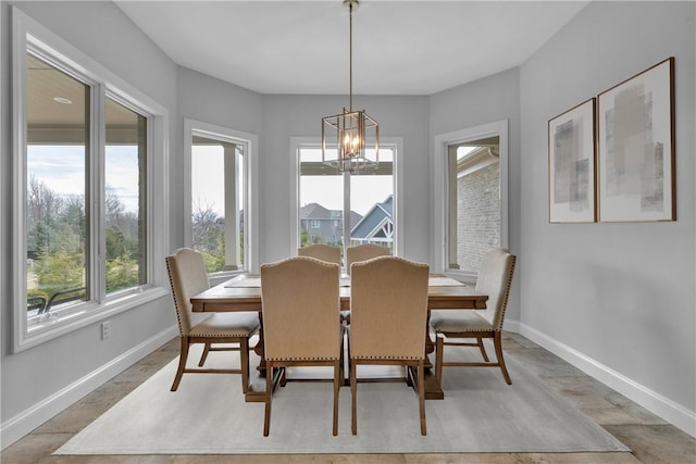 dining area with a notable chandelier