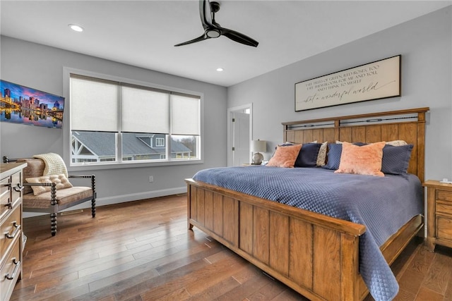 bedroom with wood-type flooring and ceiling fan