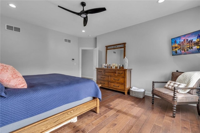 bedroom featuring hardwood / wood-style flooring and ceiling fan