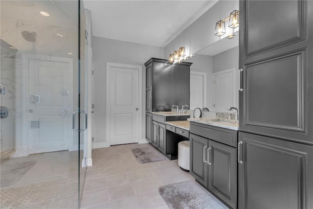 bathroom featuring walk in shower, vanity, and tile patterned flooring