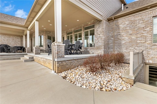 view of patio featuring a grill