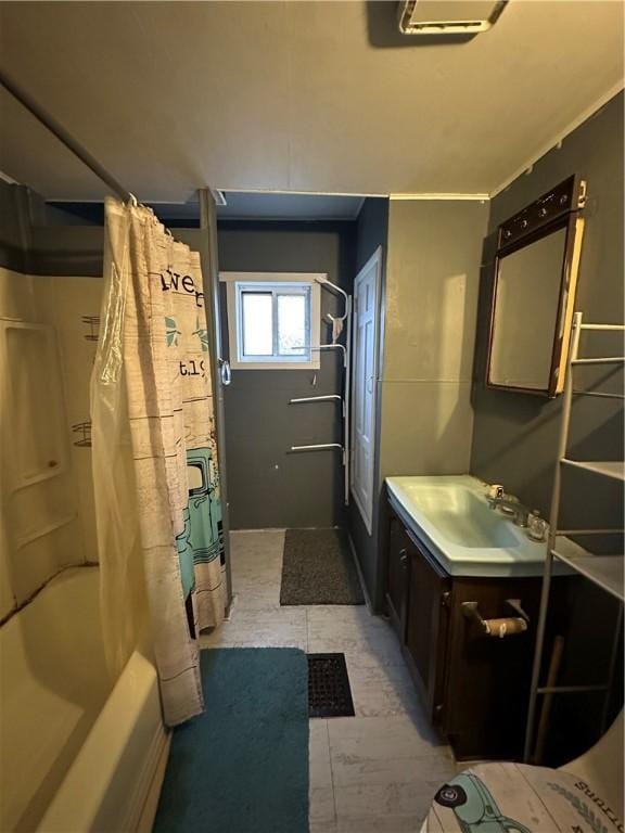 bathroom featuring vanity and shower / bath combo