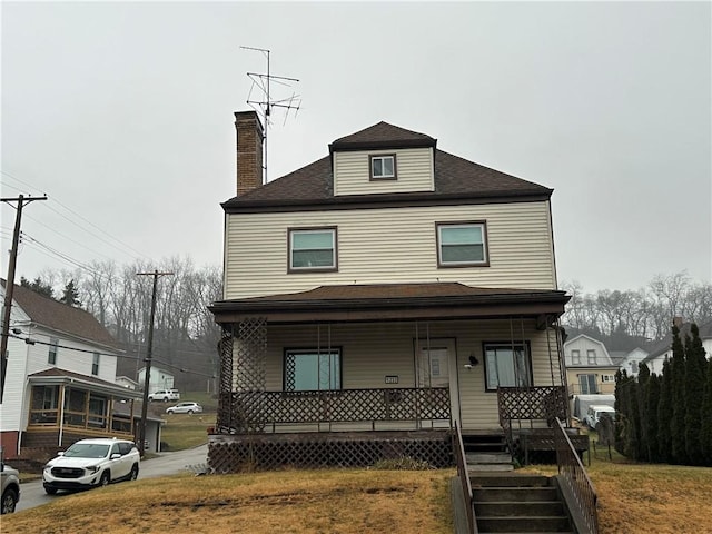 view of property with covered porch