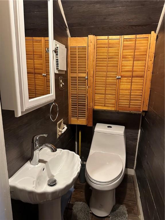 bathroom featuring sink, hardwood / wood-style floors, and toilet