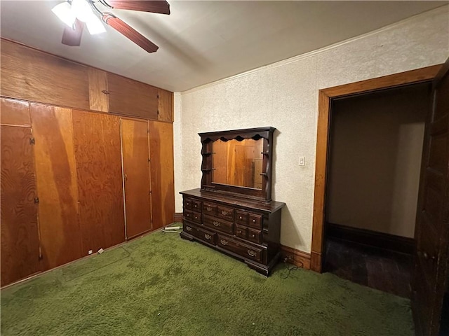 carpeted bedroom featuring a closet and ceiling fan