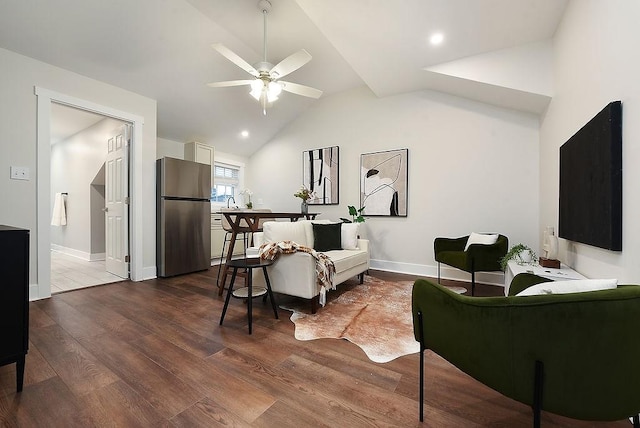 living room with ceiling fan, wood-type flooring, and high vaulted ceiling