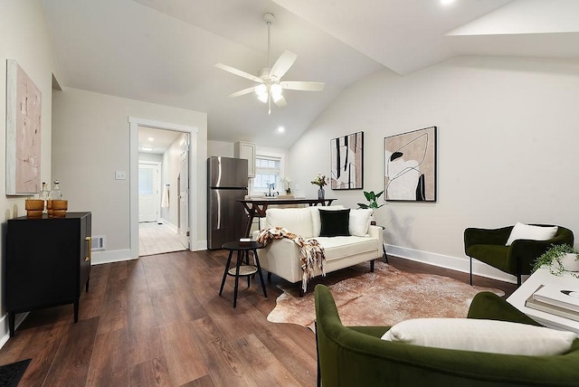 living room featuring sink, wood-type flooring, ceiling fan, and vaulted ceiling