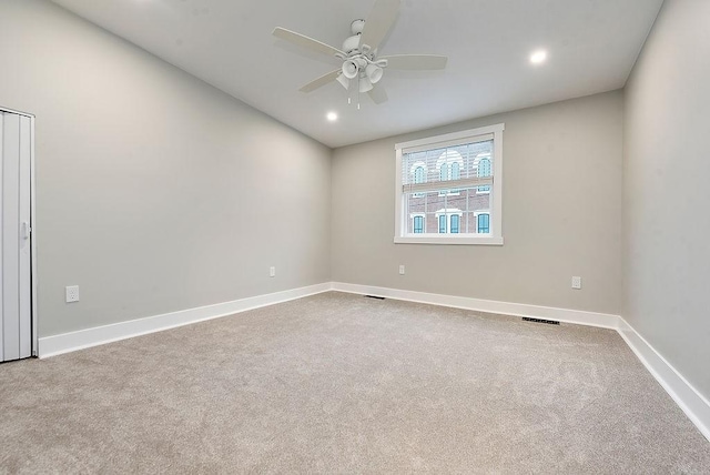 carpeted empty room with ceiling fan