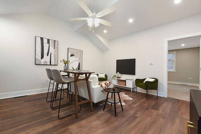 interior space with ceiling fan, dark hardwood / wood-style flooring, and vaulted ceiling