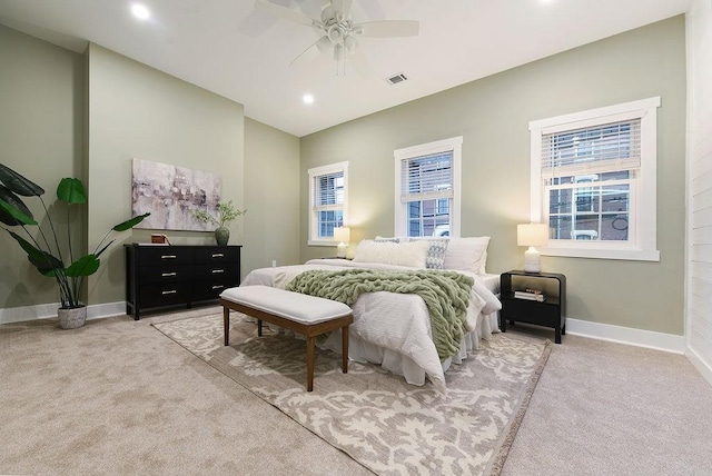 bedroom with light carpet and ceiling fan