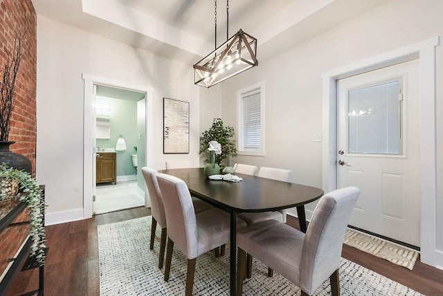 dining room with dark hardwood / wood-style floors