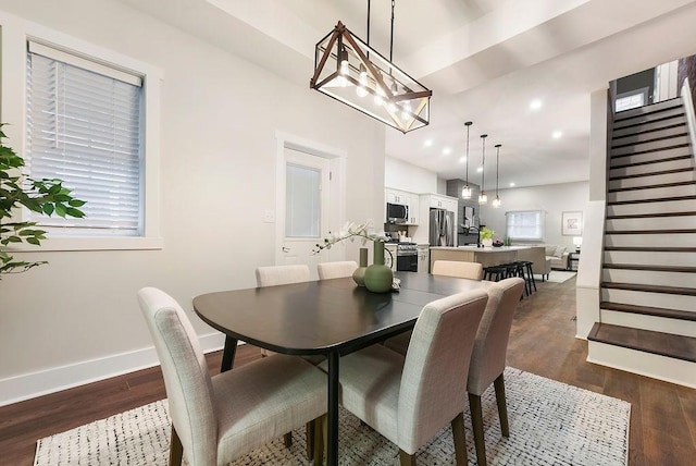 dining area with dark hardwood / wood-style flooring