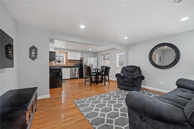 living room with light hardwood / wood-style floors