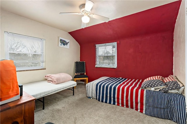 bedroom featuring lofted ceiling, ceiling fan, and carpet flooring