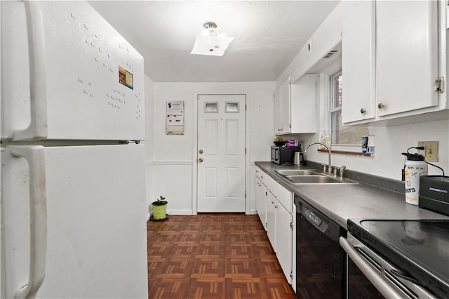 kitchen with white refrigerator, dishwasher, sink, and white cabinets